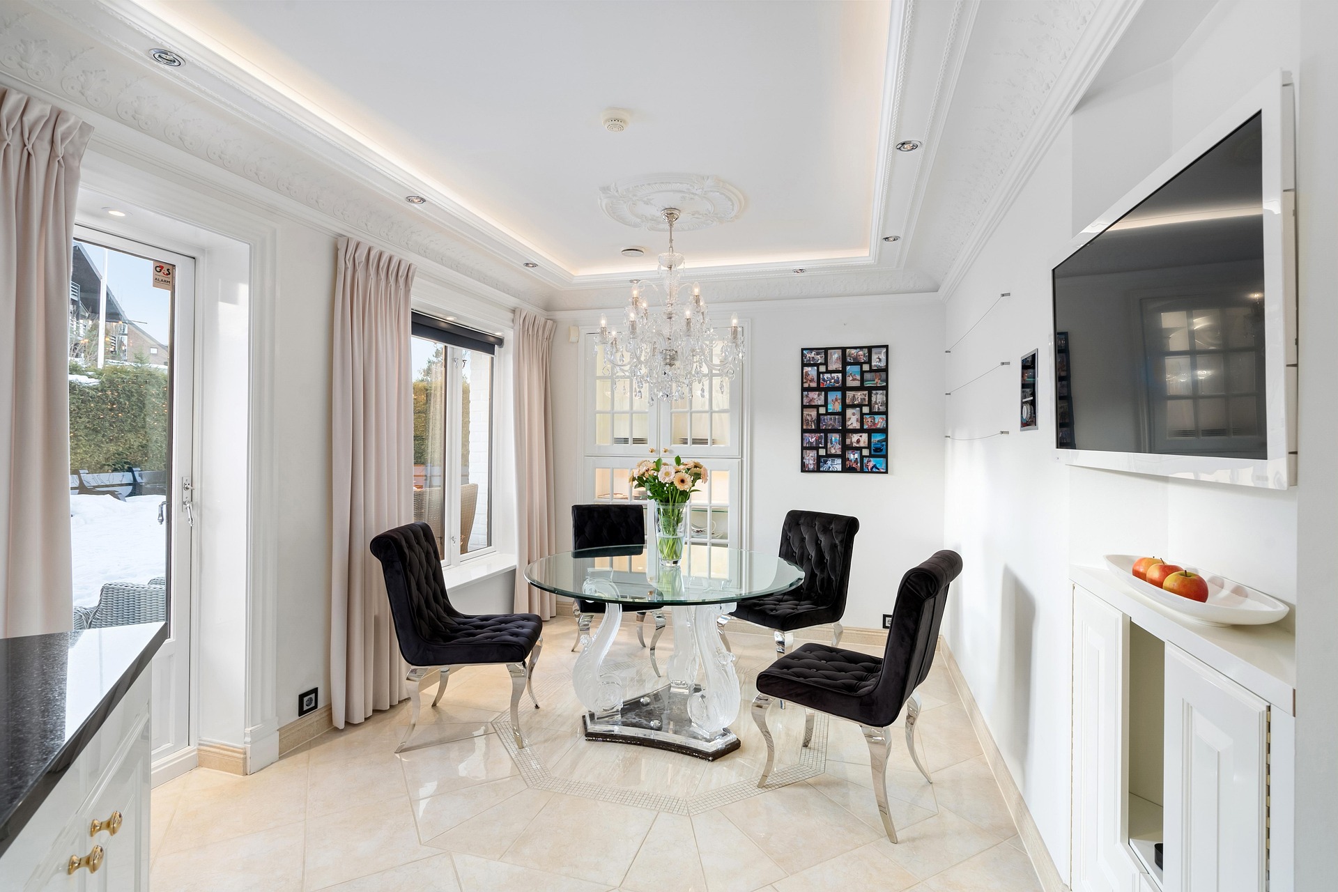 Luxury dining room with elegant chandelier and upscale furniture